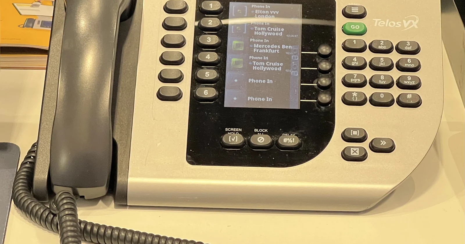 VoIP desk phone with display and line controls