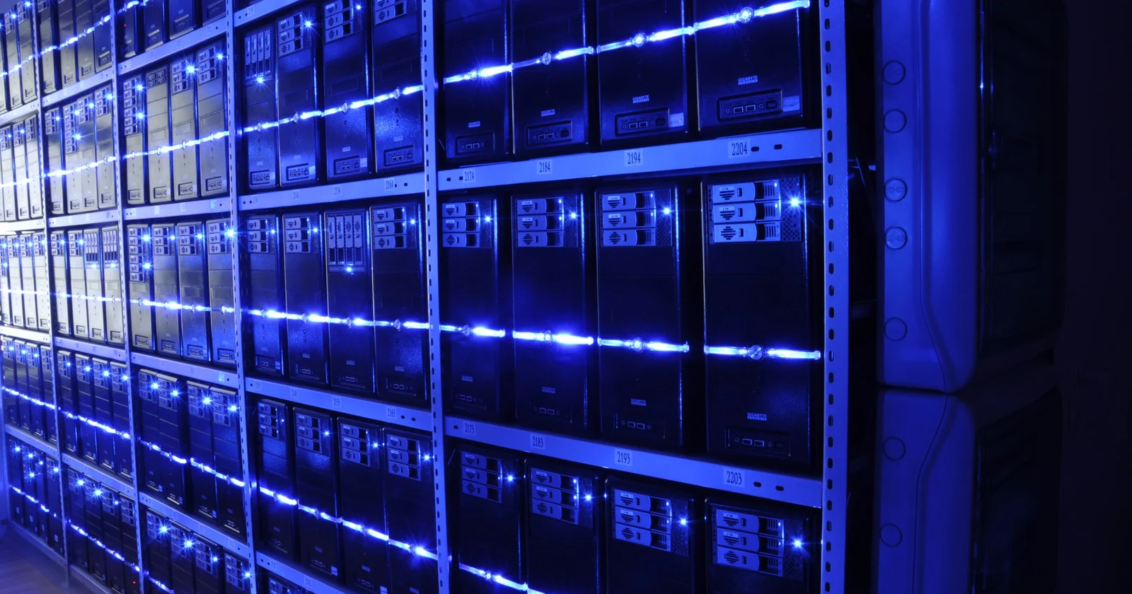 Blue lit server racks inside a data center
