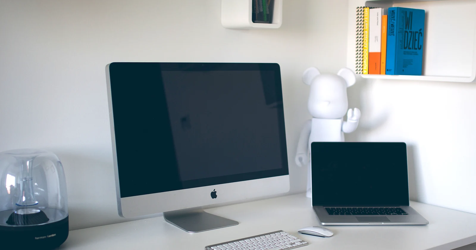 Desktop computer and laptop on an office table