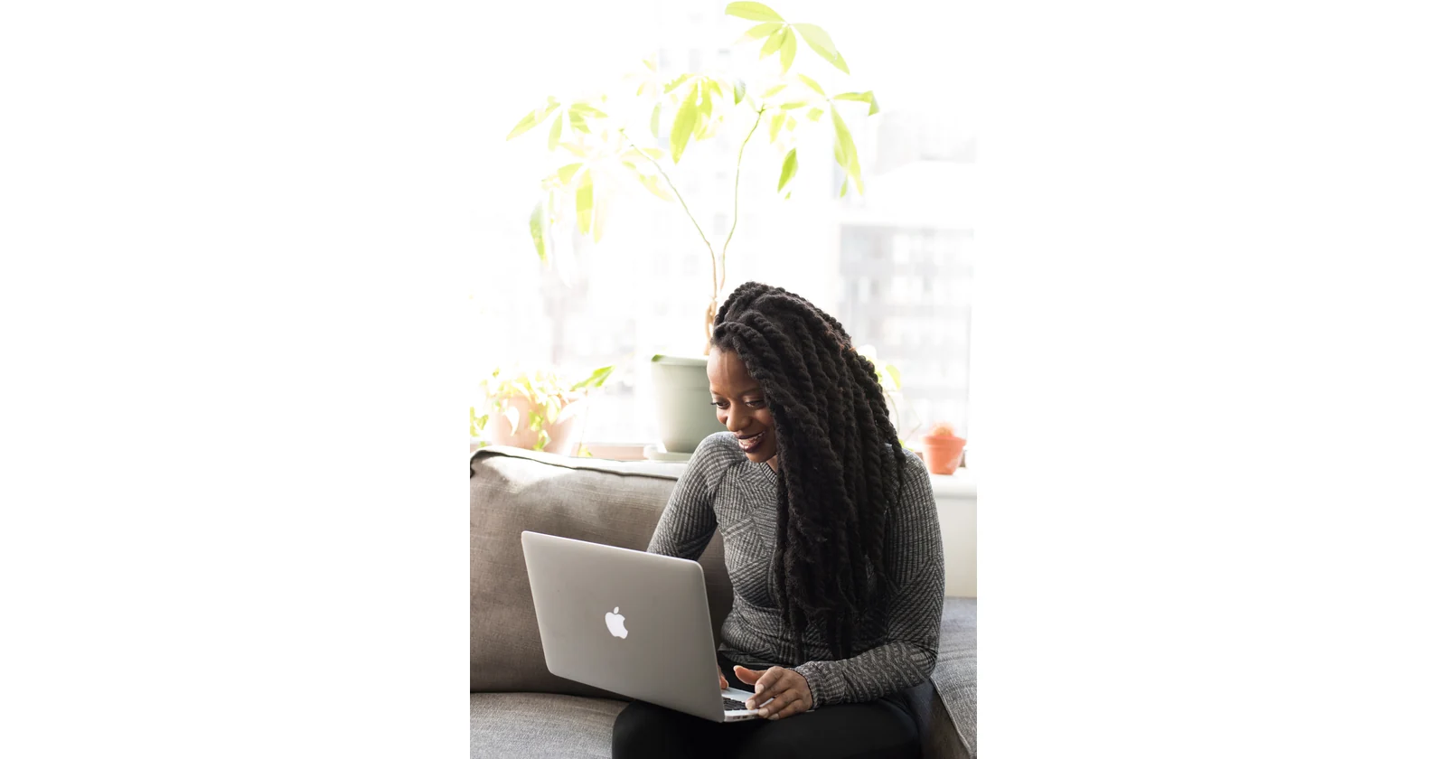 Woman using a laptop while working remotely
