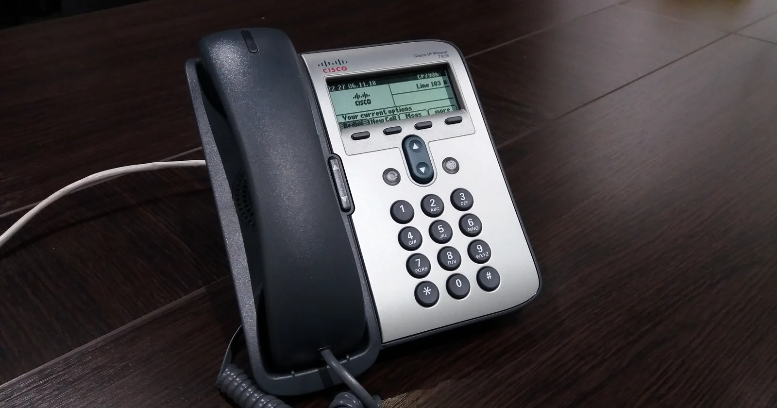 Business IP phone connected by an Ethernet cable