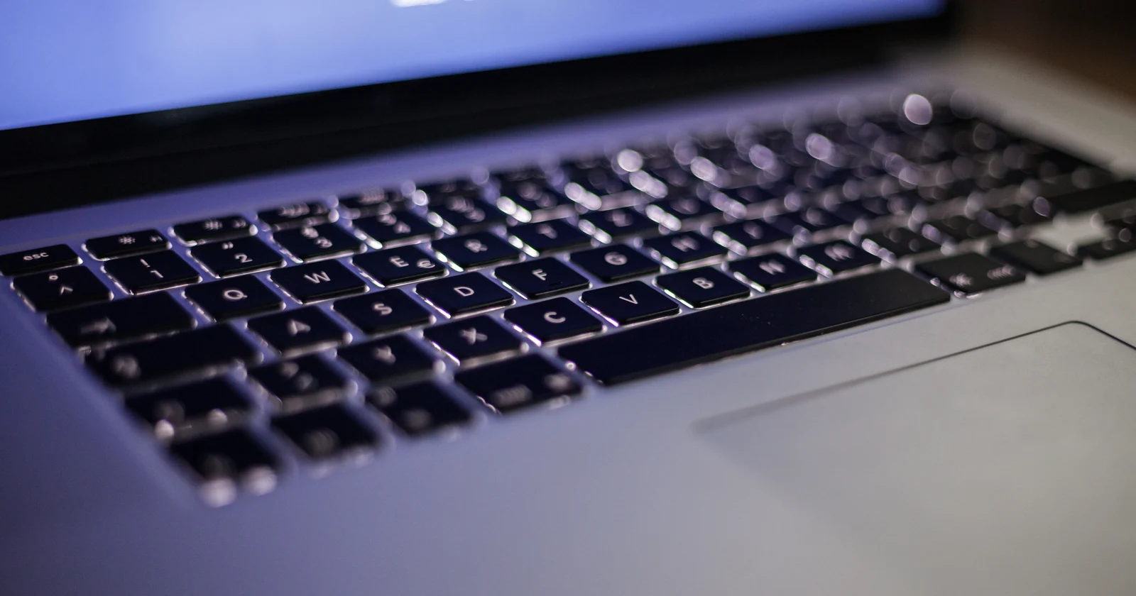 Laptop keyboard below a user sign in screen