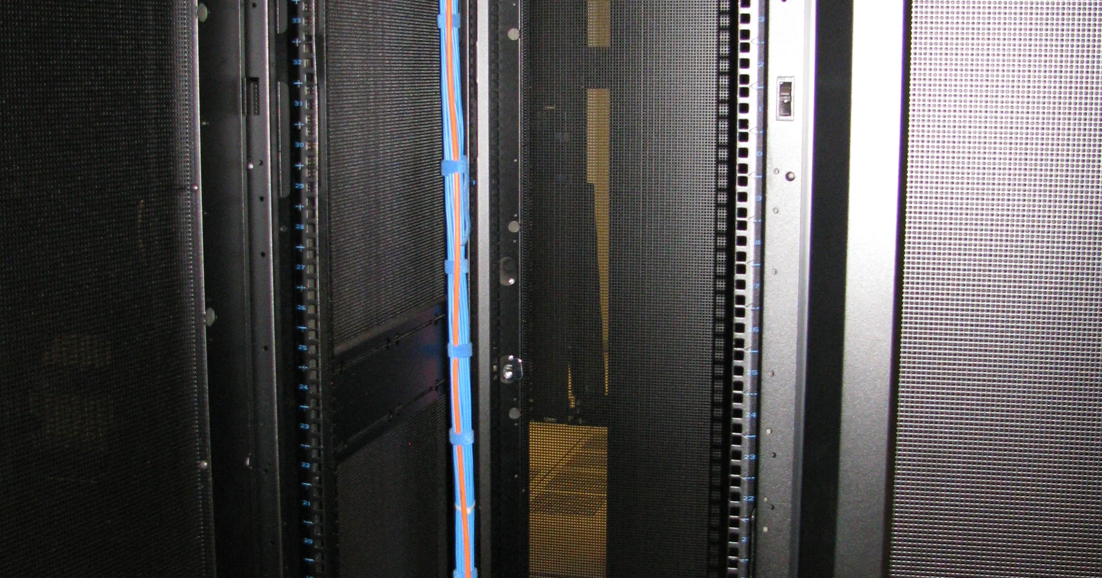 Rear of an equipment cabinet with network hardware