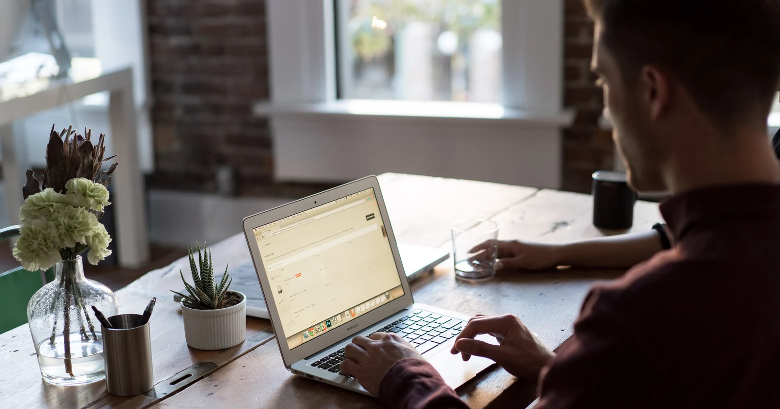 Office worker using a laptop at a desk