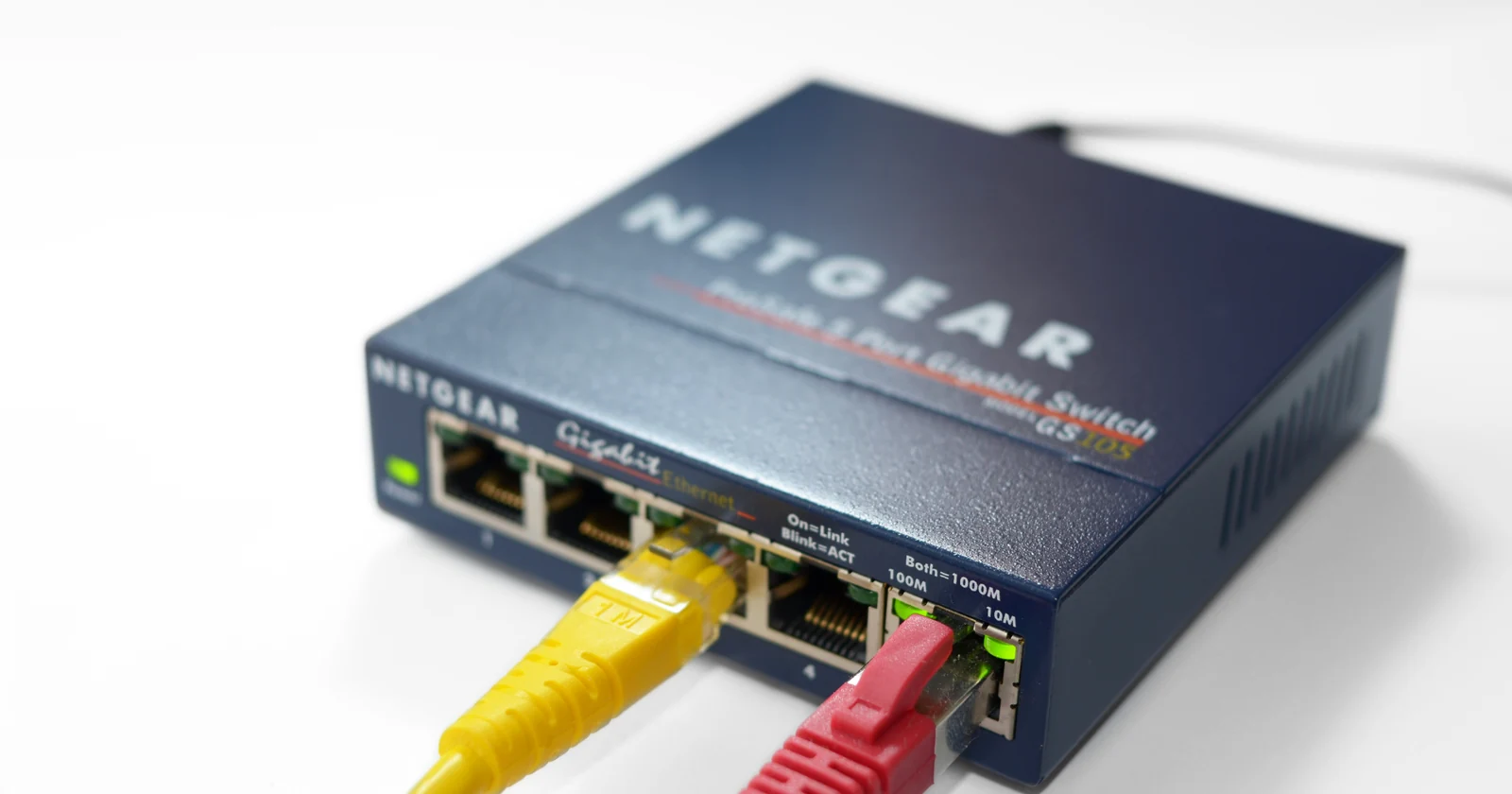 Network switch connected to colored Ethernet cables